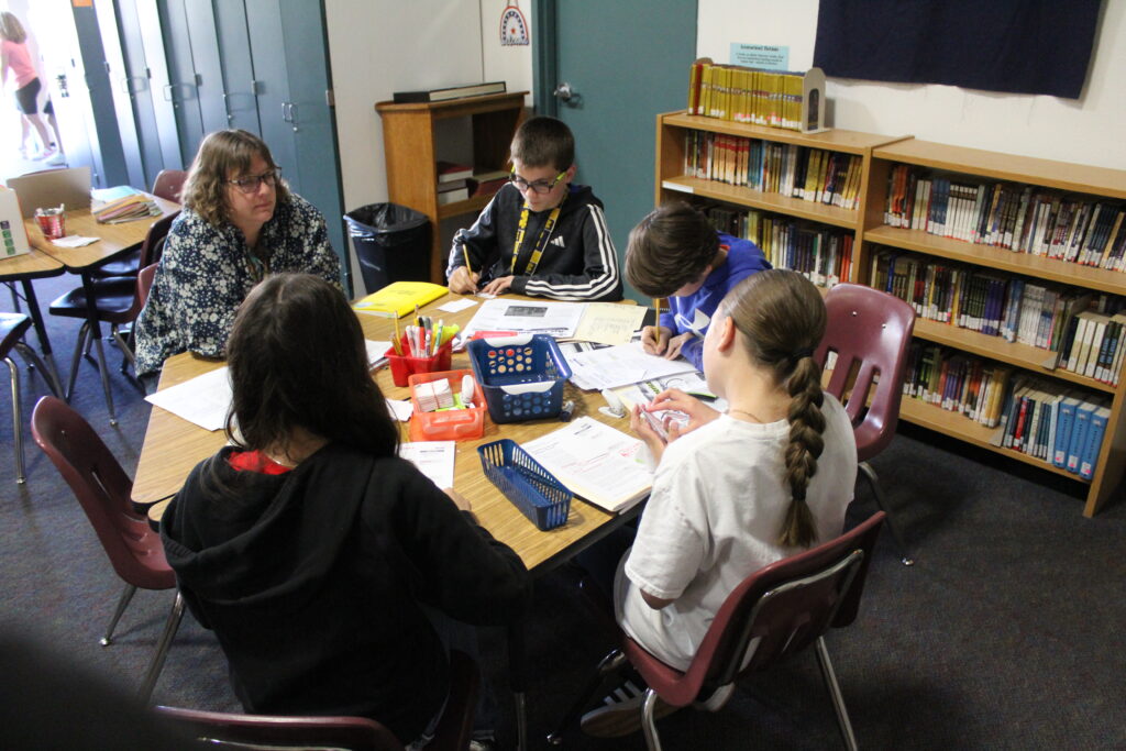EDUPRIZE Gilbert students engaged in small-group learning and personalized instruction in a low-ratio classroom environment