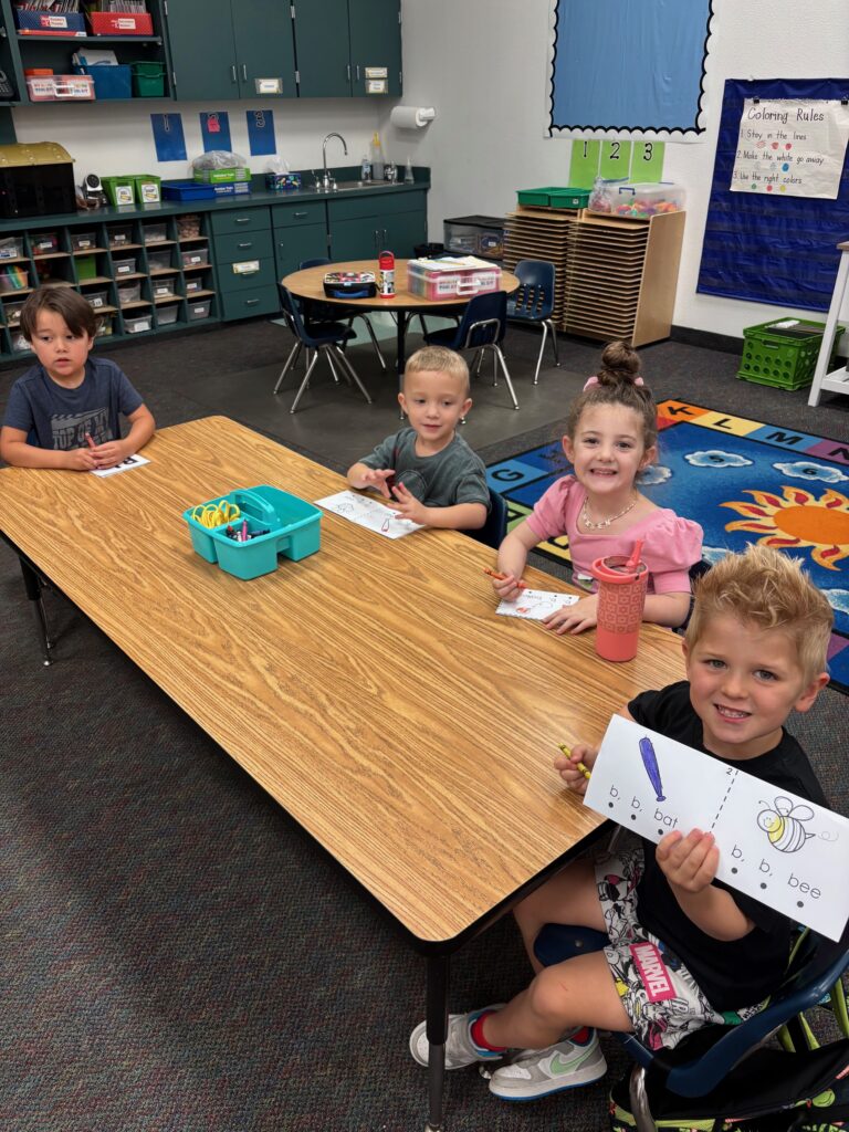 EDUPRIZE Pre-K teacher helping student with hands-on activity
